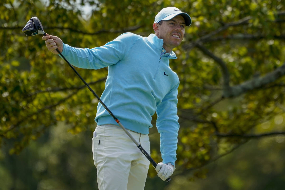 Rory McIlroy, of Northern Ireland, watches his shot from the second tee during the final round ...