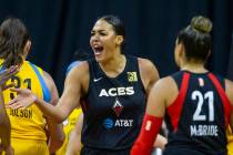 Las Vegas Aces center Liz Cambage (8) gets pumped after a basket over the Chicago Sky defenders ...
