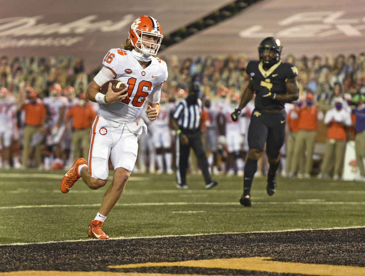 Clemson quarterback Trevor Lawrence scores against Wake Forest during the first half of an NCAA ...