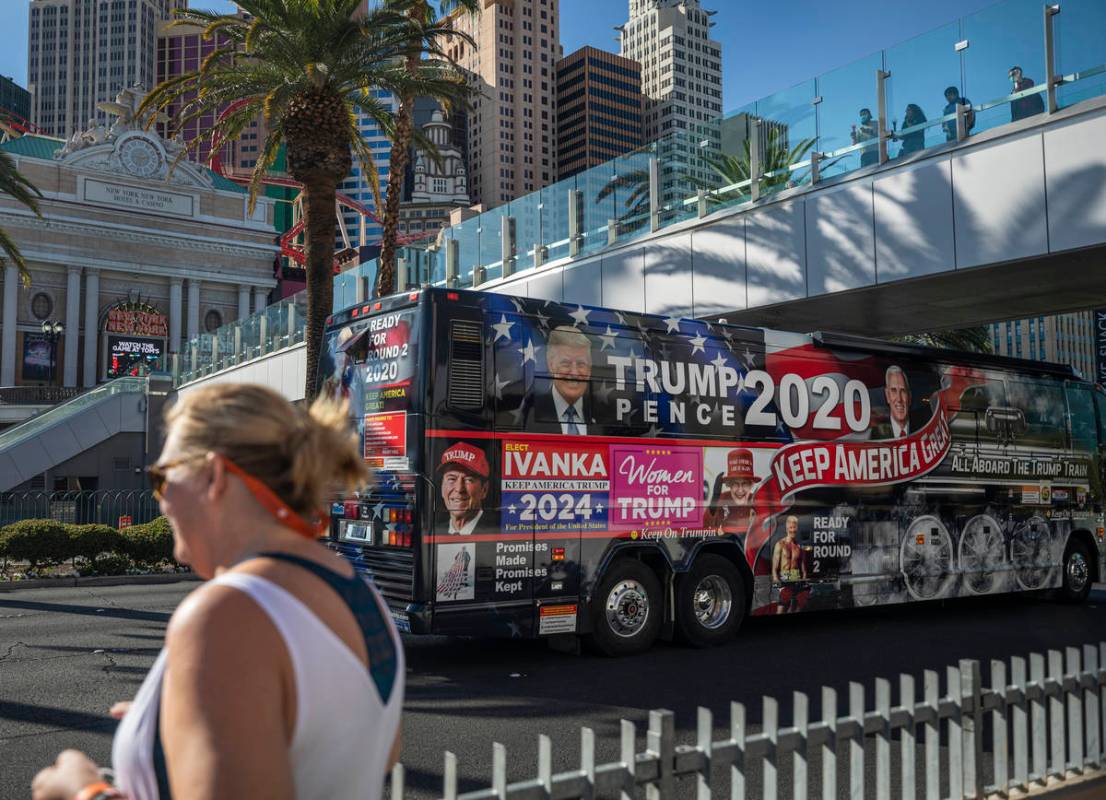 Hope Moore of Rock Hill, South Carolina, is seen while a Trump 2020 bus rides down the Las Vega ...
