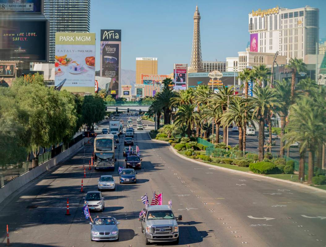 A caravan of Trump supporters ride down the Las Vegas Strip, on Wednesday, Sept. 30, 2020. (Eli ...