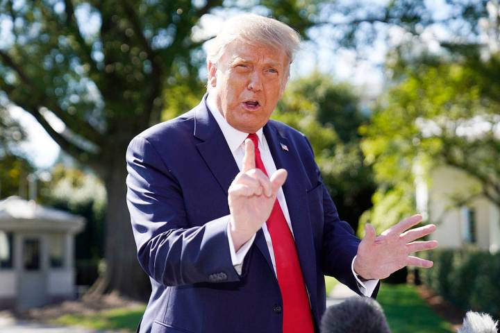 President Donald Trump speaks to the media before boarding Marine One at the White House, Wedne ...