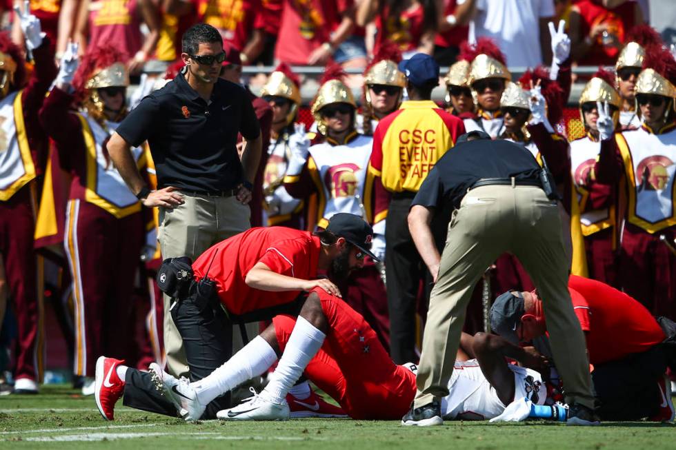 Medical officials check on UNLV Rebels wide receiver Kendal Keys (84) during the first half of ...