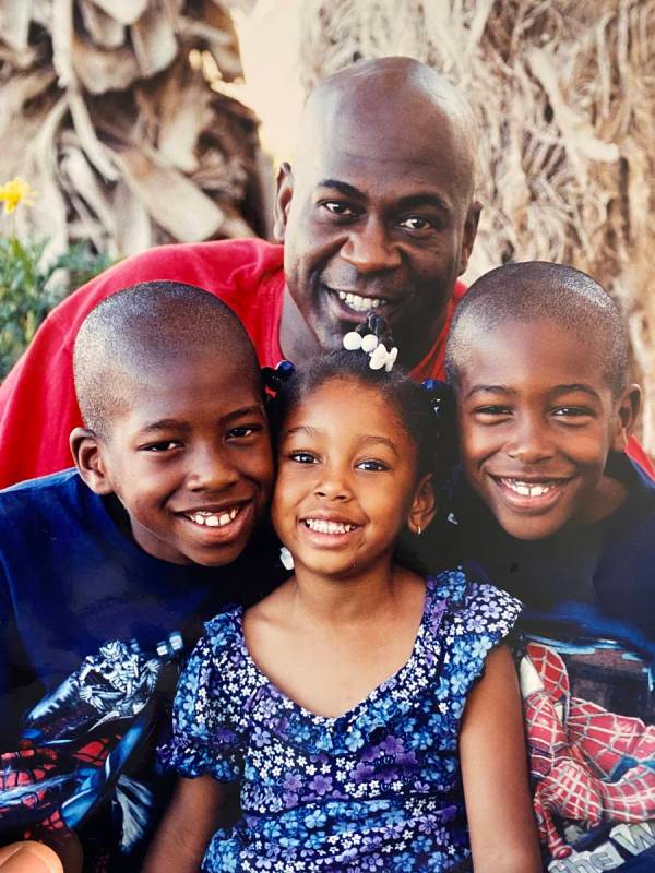 Kenny Keys (right) poses for a photo with his father, Kenny Sr. (top), brother, Kendal (left) a ...