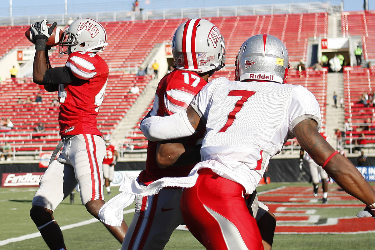 UNLV's Kenny Keys (44) intercepts a pass intended for New Mexico's Lamaar Thomas (7) during the ...