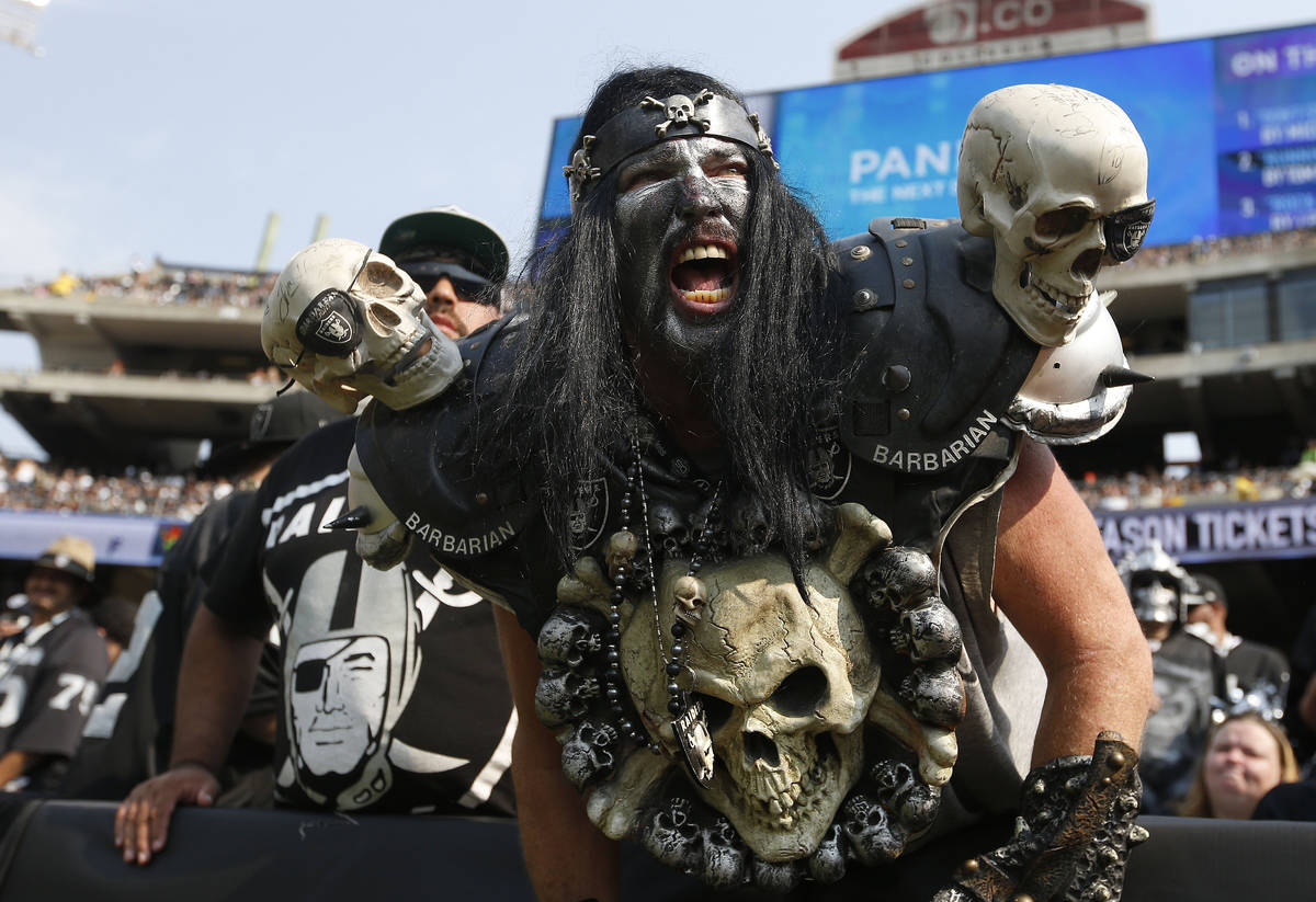 FILE - In this Sept. 13, 2015, file photo, Oakland Raiders fans watch during the second half of ...