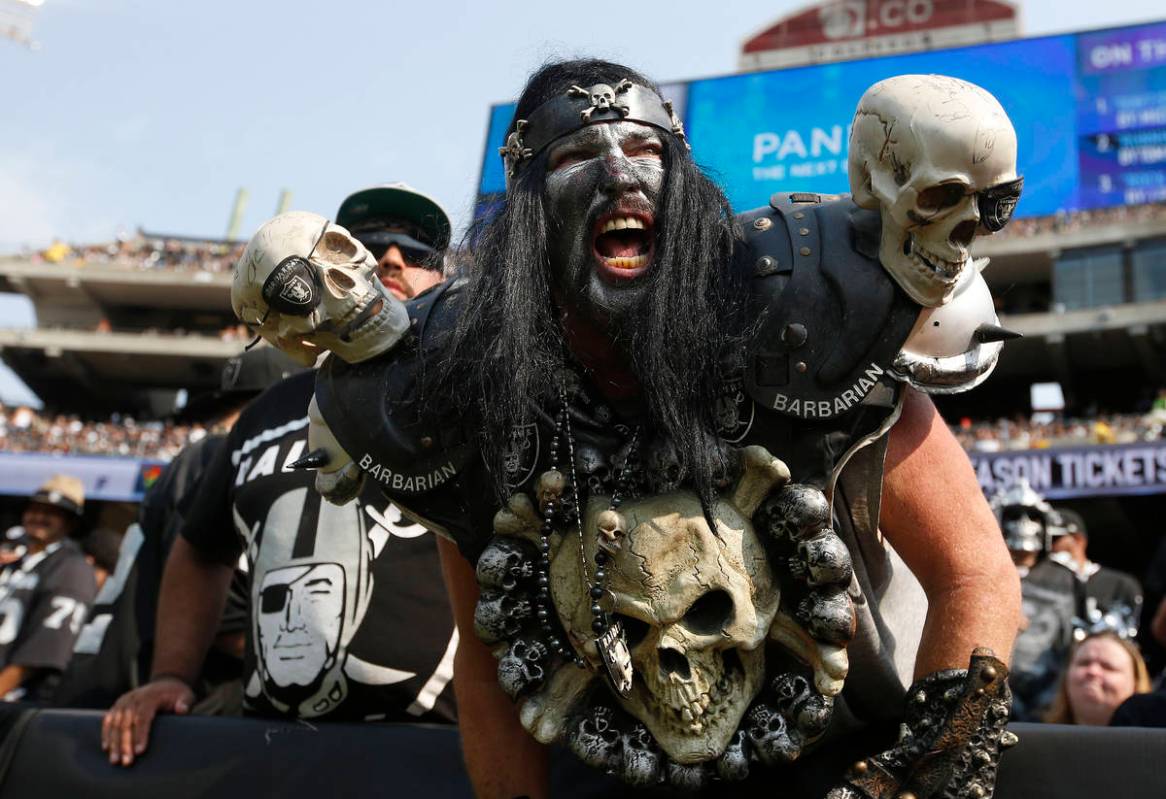 FILE - In this Sept. 13, 2015, file photo, Oakland Raiders fans watch during the second half of ...