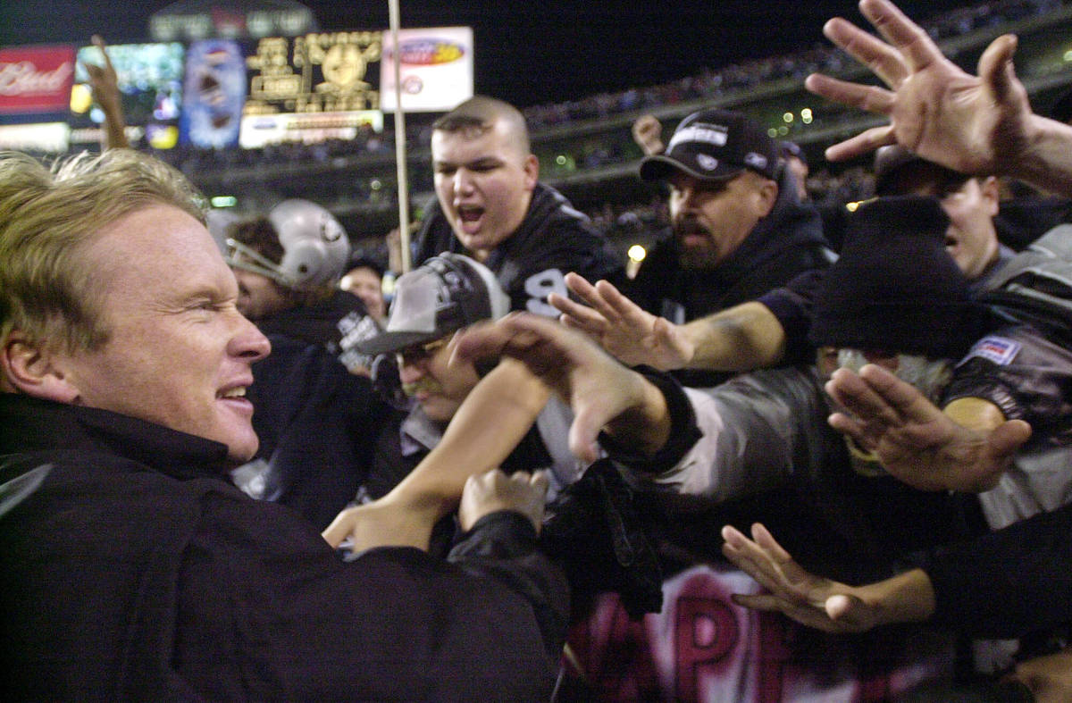 FILE - In this Jan. 12, 2002, file photo, Oakland Raiders head coach Jon Gruden greets fans in ...