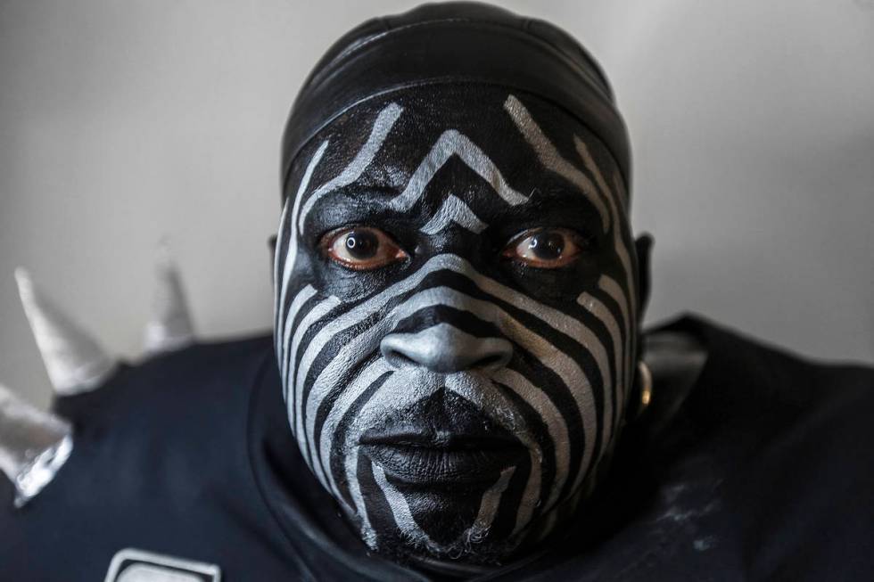 Raiders super fan Wayne Mabry, known as "Violator," in his hotel room at 4 a.m. in Du ...