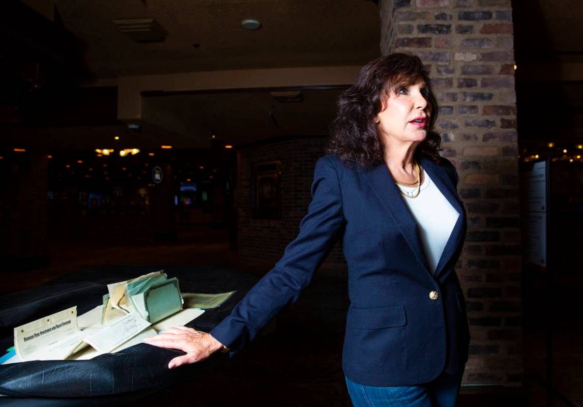 Gina Silvagni Perry, granddaughter of P.O. Silvagni, who opened Hotel Apache in 1932, stands by ...