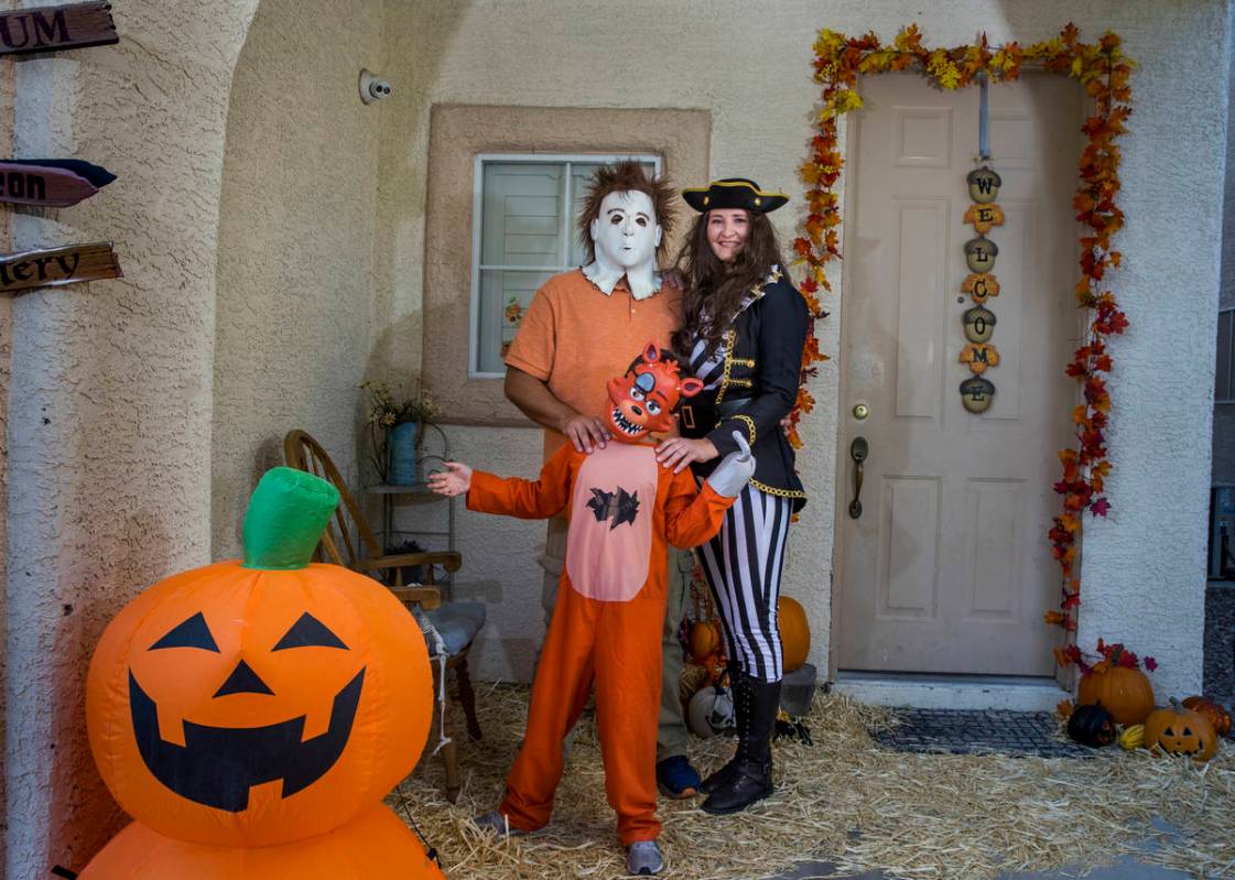 (Clockwise from bottom) Alex Montenegro, 8, with parents Joe and Kim Cabrero in costumes with t ...