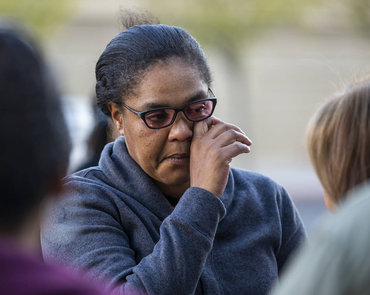 Kelly Williams wipes away a tear while speaking during the National Day of Outrage rally outsid ...