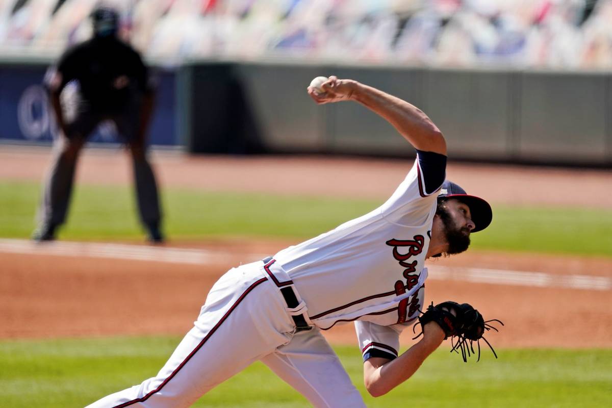 Atlanta Braves starting pitcher Ian Anderson throws against the Cincinnati Reds in Game 2 of a ...