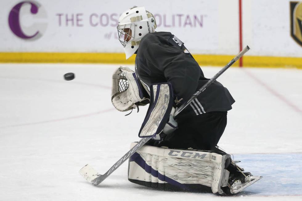 Vegas Golden Knights' Isaiah Saville makes a block during a development camp scrimmage at City ...