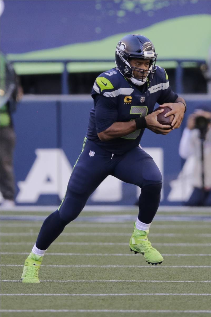 Seattle Seahawks quarterback Russell Wilson in action against the Dallas Cowboys during an NFL ...