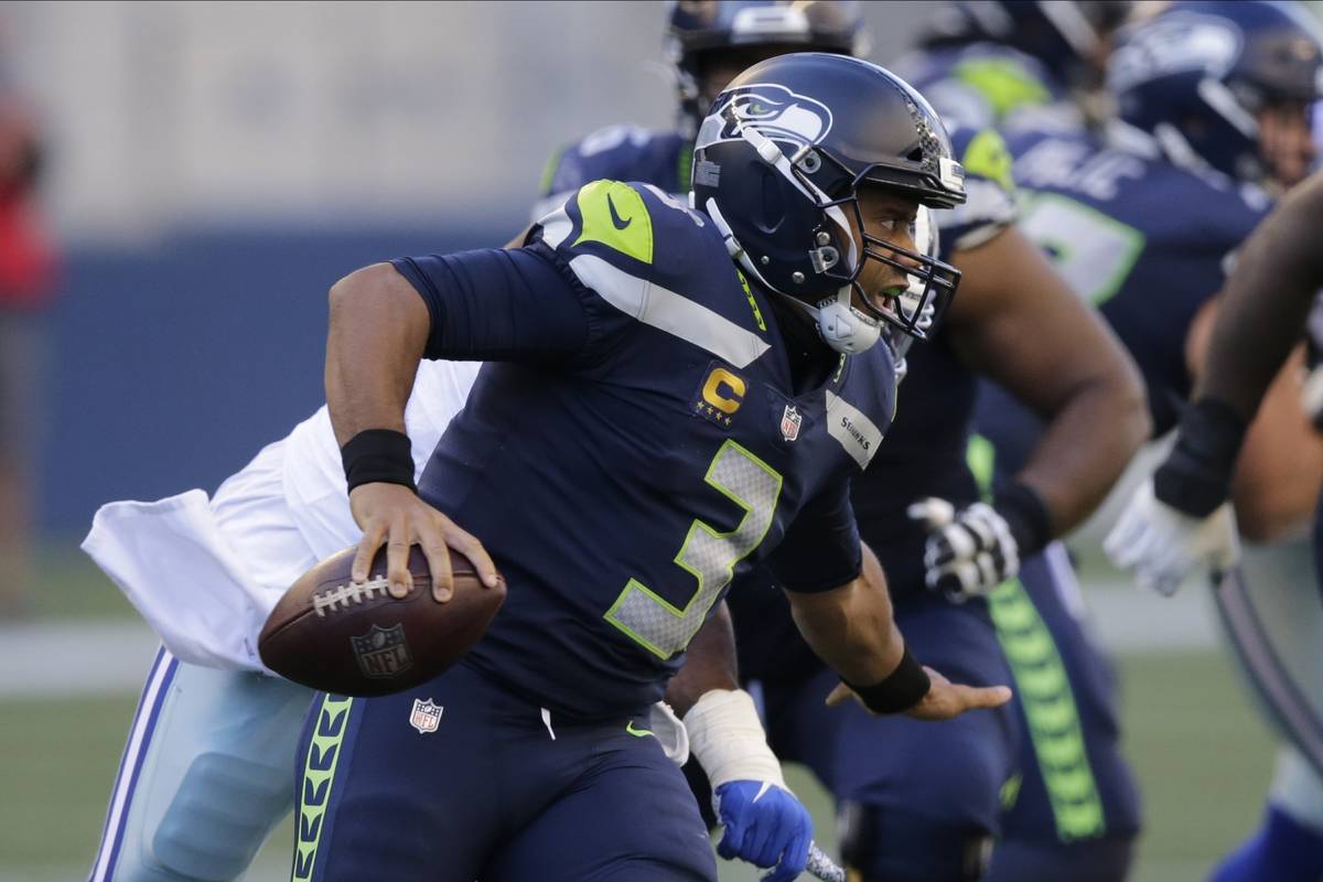 Seattle Seahawks quarterback Russell Wilson in action against the Dallas Cowboys during an NFL ...