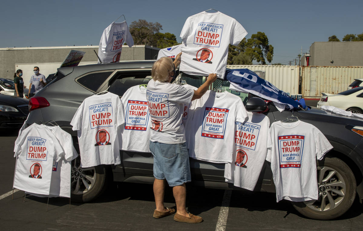 Norm Wright decorates his car with t-shirts for sale before Democratic vice presidential nomine ...