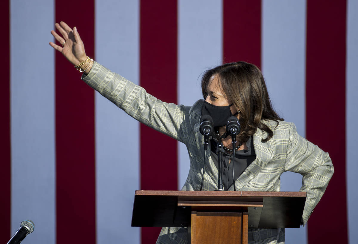 Democratic vice presidential nominee Kamala Harris waves to the crowd during a drive-in rally a ...