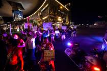 People march along Las Vegas Boulevard in memory of Jorge Gomez and other victims of police vio ...