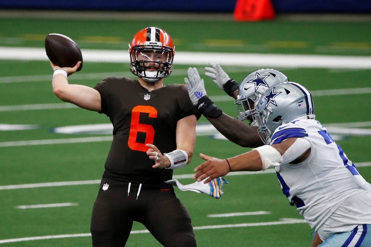 Cleveland Browns quarterback Baker Mayfield (6) throws a pass under pressure from the Dallas Co ...