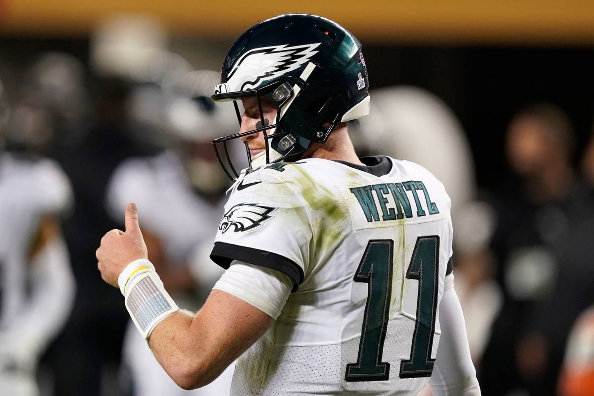 Philadelphia Eagles quarterback Carson Wentz (11) gestures during the second half of an NFL foo ...