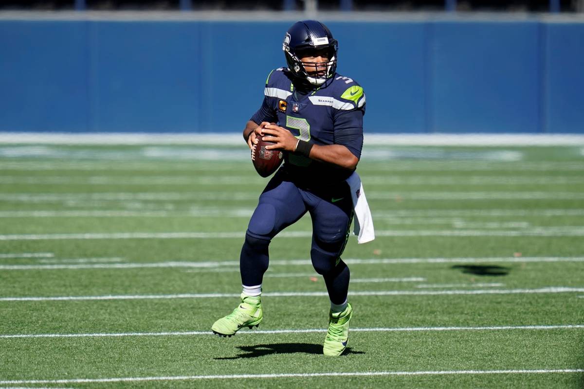 In this Sunday, Sept. 27, 2020, file photo, Seattle Seahawks quarterback Russell Wilson looks t ...