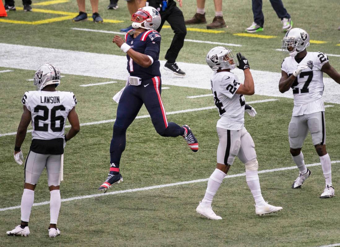 New England Patriots quarterback Cam Newton (1) celebrates a big run against Las Vegas Raiders ...