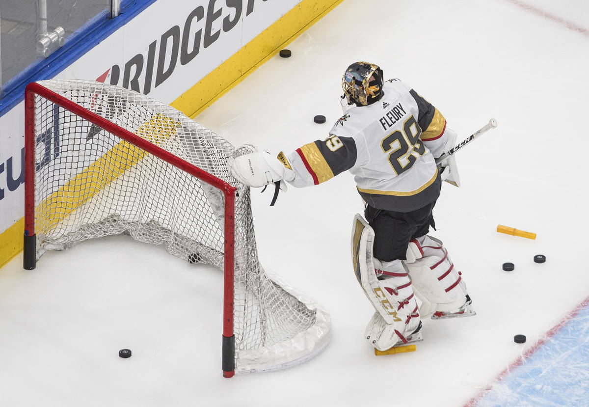 Vegas Golden Knights goalie Marc-Andre Fleury moves the net before leaving the ice during warmu ...