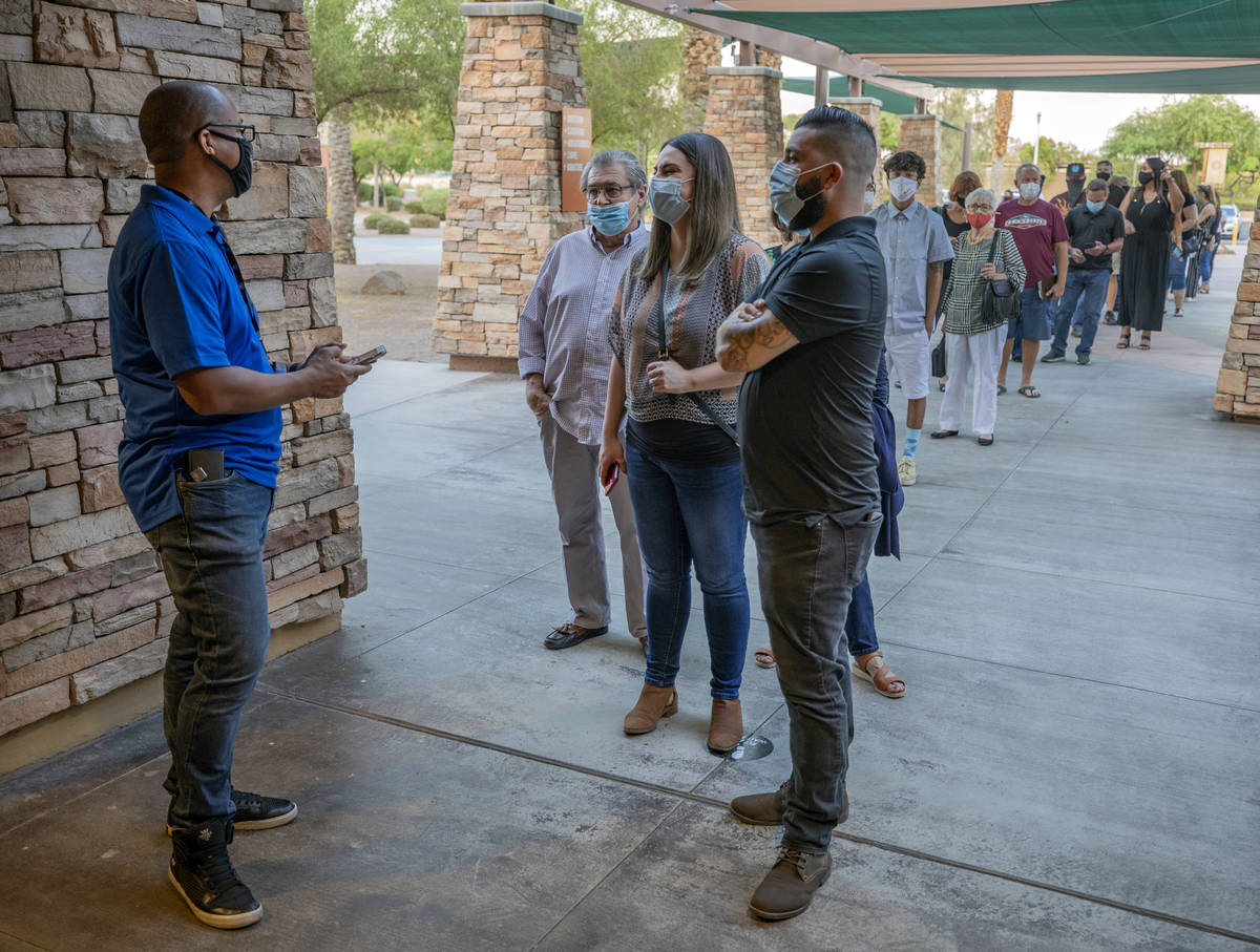 Canyon Ridge Christian Church attendees are checked in in for their reservation for the church& ...