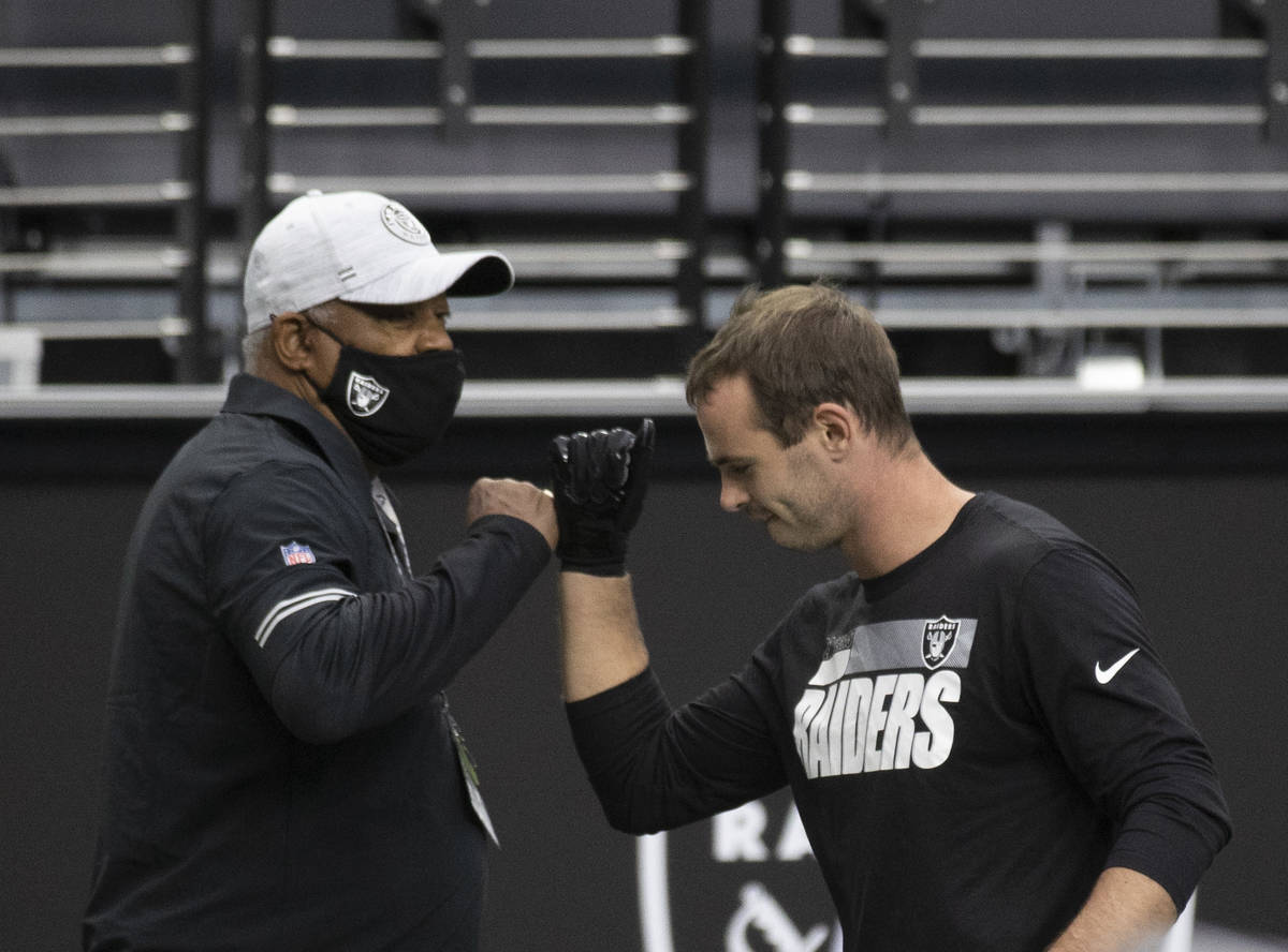 Las Vegas Raiders wide receiver Hunter Renfrow (13) greets Raiders staff during warms ups befor ...