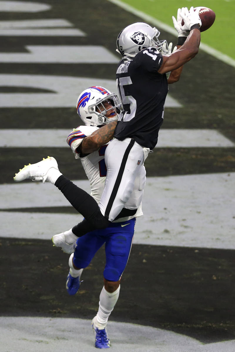 Las Vegas Raiders wide receiver Nelson Agholor (15) makes a catch for a touchdown under pressur ...
