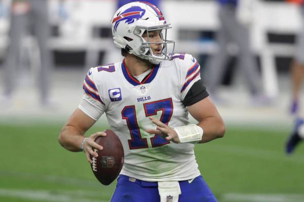 Buffalo Bills quarterback Josh Allen (17) looks to pass against the Las Vegas Raiders during th ...