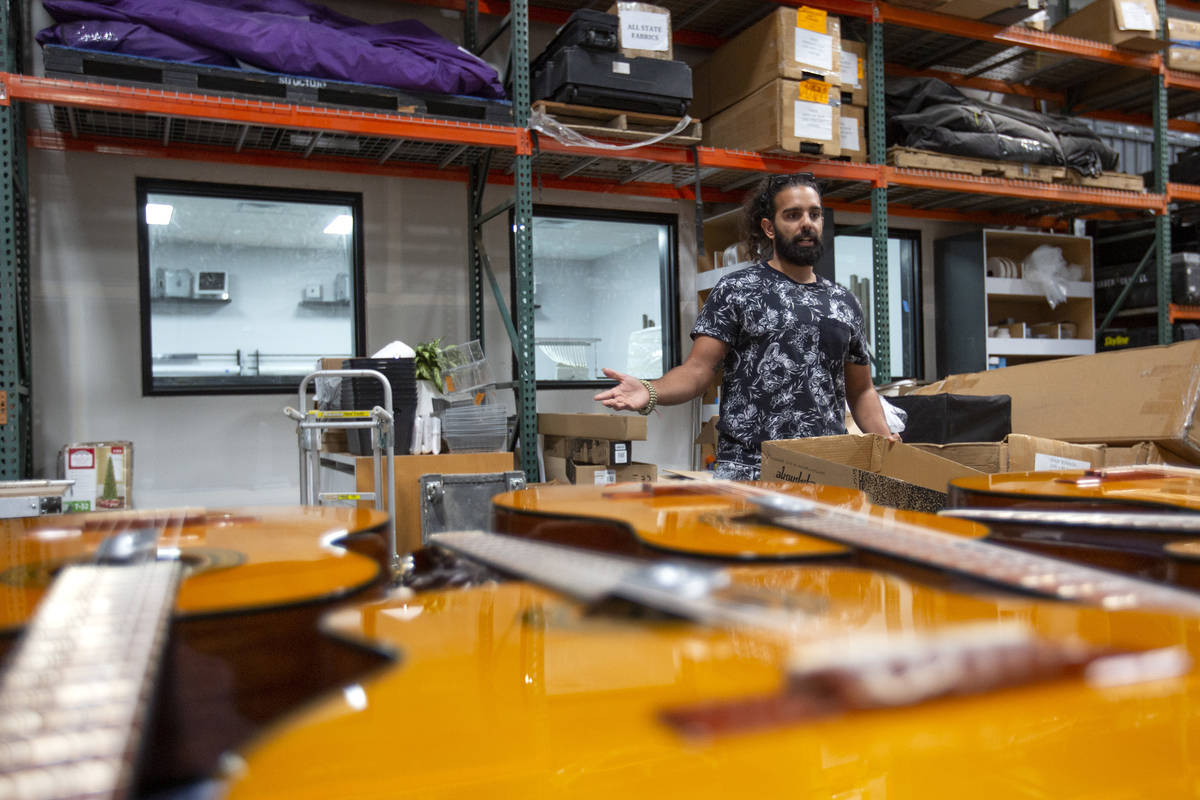 Ryan Patrick, guitarist for Las Vegas band Otherwise, unloads a shipment of guitars at Structur ...