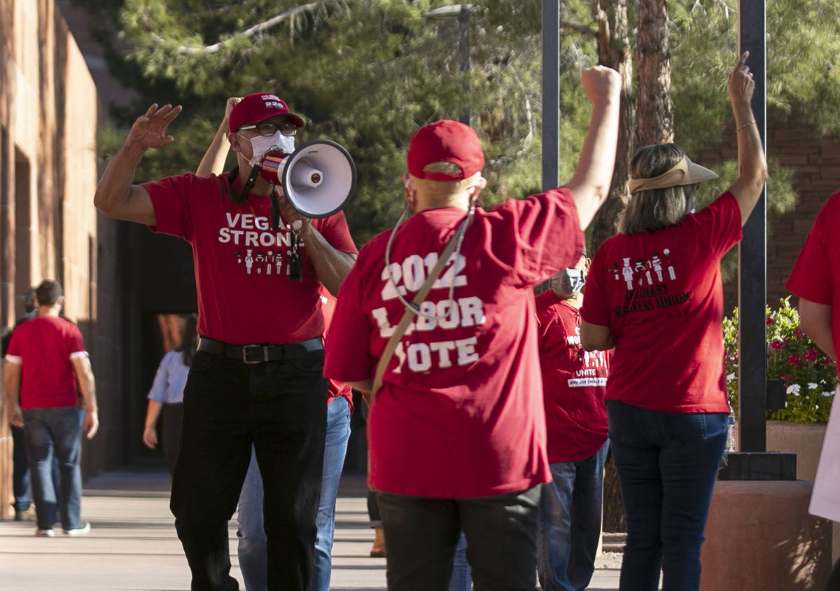 Jose Rivera, left, rally organizer, shouts slogans as he joins a rally outside of the Clark Co ...