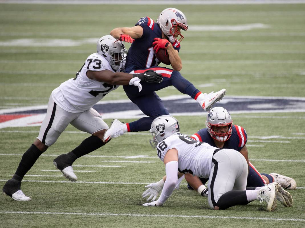 Las Vegas Raiders defensive tackle Maurice Hurst (73) tackles New England Patriots wide receiv ...