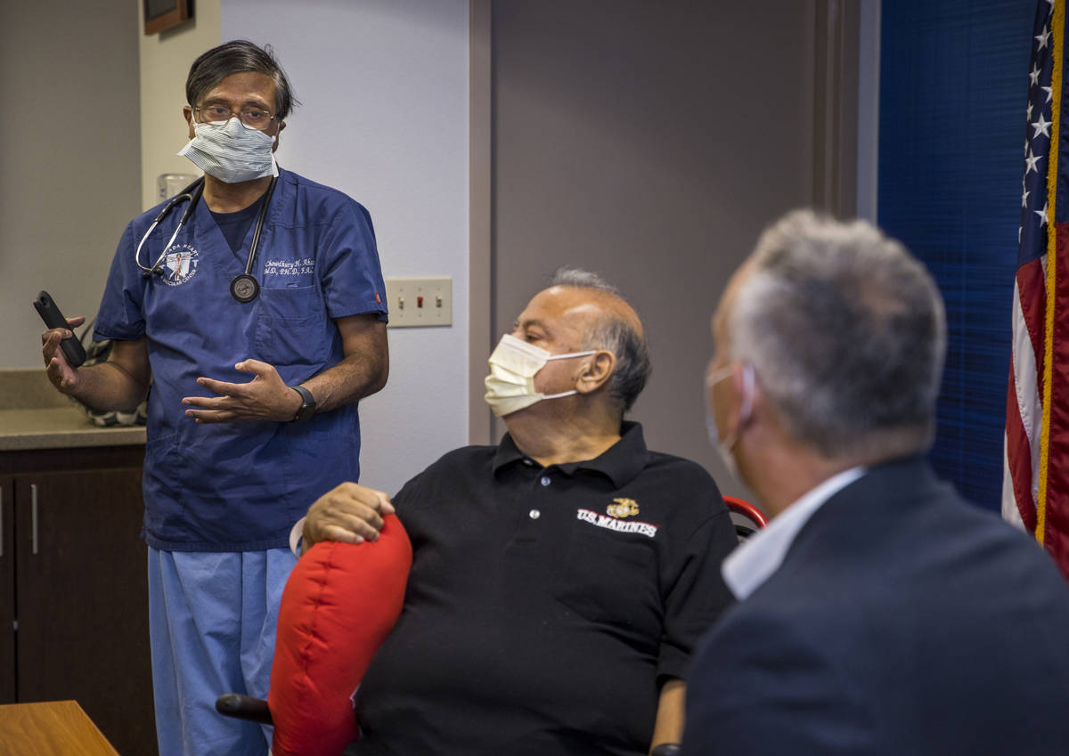 (From left) Dr. Chowdhury Ahsan talks about patient Pablo Bernabe with University Medical Cente ...