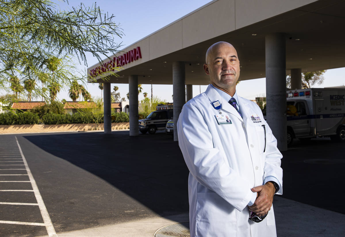 Dr. Robert Smith, associate chief medical officer for Sunrise Hospital, poses for a portrait in ...