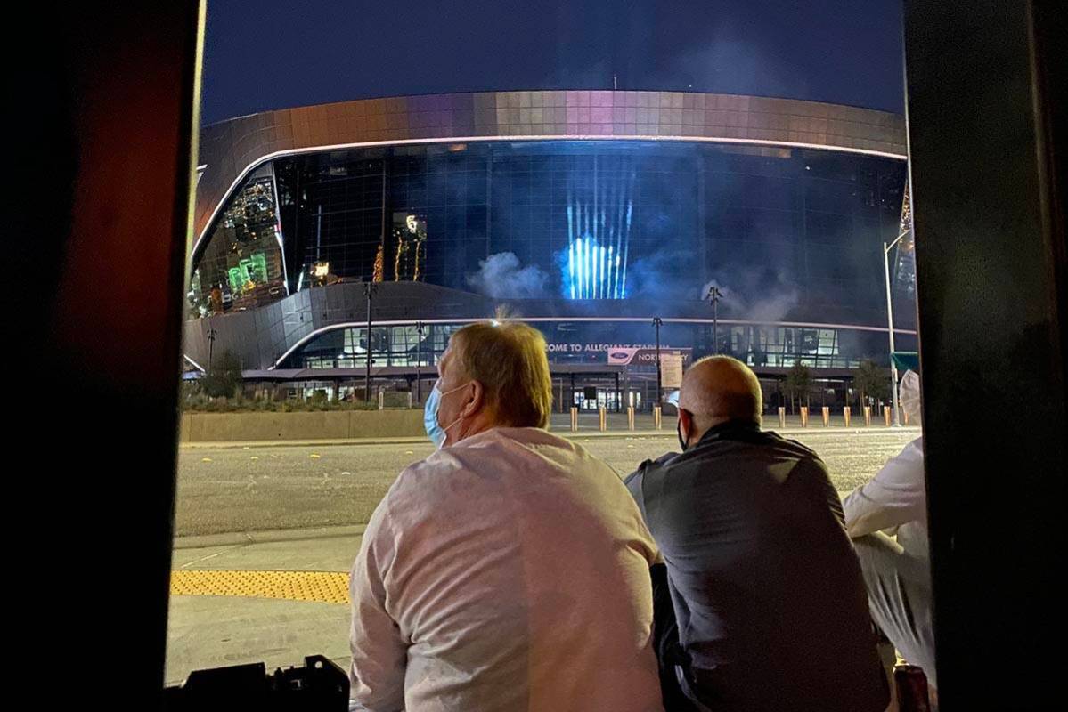 Raiders owner Mark Davi, left, and team president Marc Badain sit outside Allegiant Stadium on ...