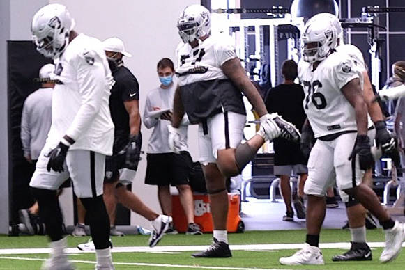 Las Vegas Raiders offensive linemen, from left, guard Patrick Omameh (78), tackle Trent Brown ( ...