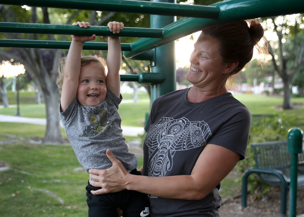 Summerlin resident Jennifer Dabney plays with her son Maverick, 2, at The Crossing Park playgro ...