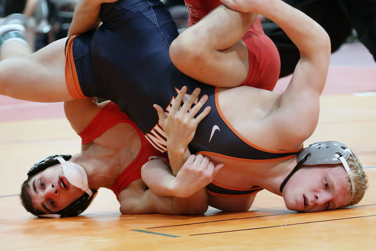 Cornell University's Michael Russo, left, and, Louie Hayes of Virginia wrestle during the 36th ...