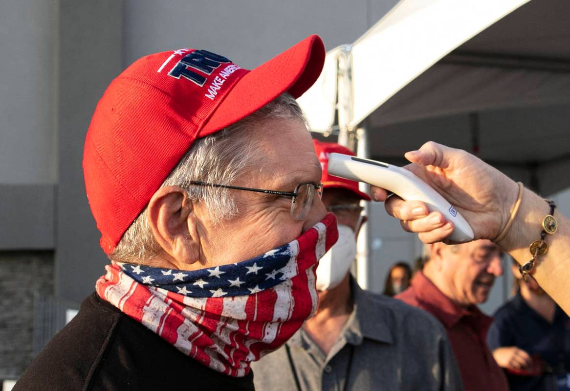 Make America Great Again event attendees get their temperature checked at Boulder City Airport ...