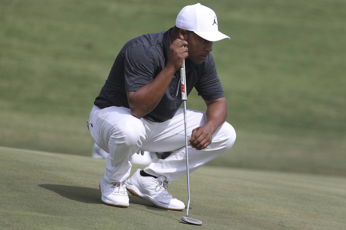 Harold Varner III gets ready to putt on the ninth hole during the first round of the Shriners H ...