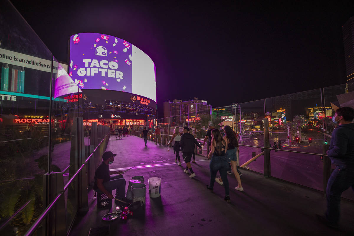 Tourists are seen on the Las Vegas Strip, early Thursday, Oct. 8, 2020. (Elizabeth Brumley/Las ...