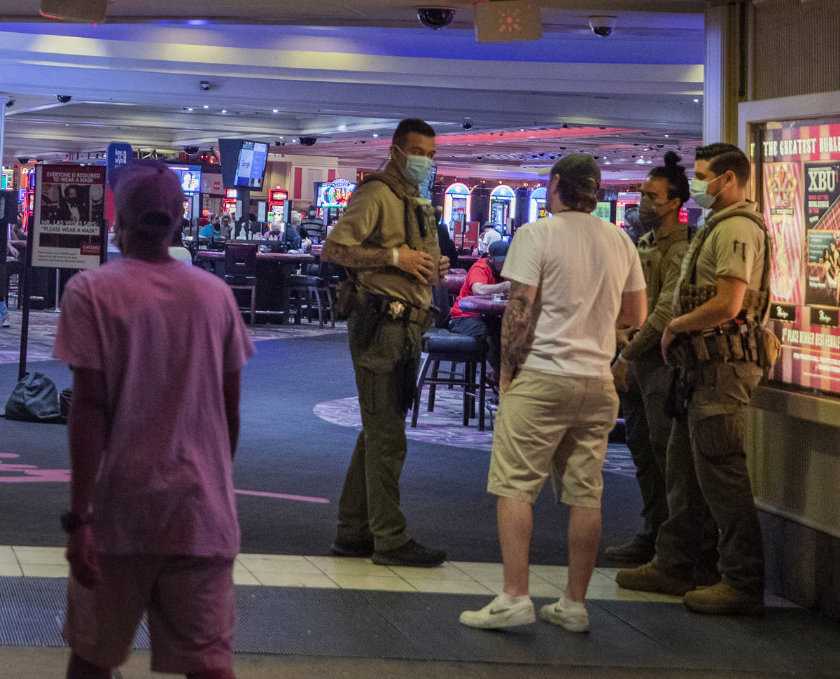 Security guards are seen at an entrance of the LINQ Hotel and Casino, on the Las Vegas Strip ea ...