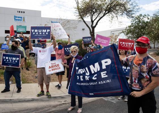 President TrumpÕs supporters, including Michael, right, who declined to give his name, and ...