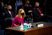 Supreme Court nominee Amy Coney Barrett arrives for her Senate Judiciary Committee confirmation ...