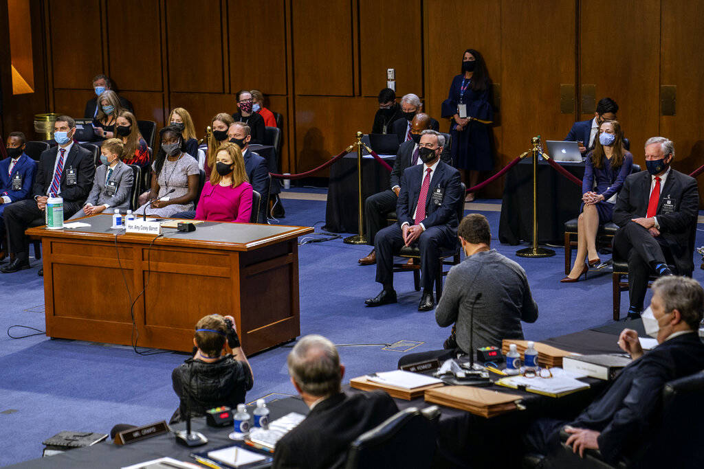 Supreme Court nominee Amy Coney Barrett listens during her Senate Judiciary Committee confirmat ...