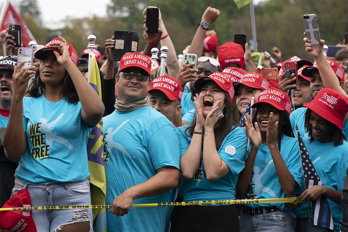 Supporters of President Donald Trump rally at The Ellipse, before entering to the White House, ...