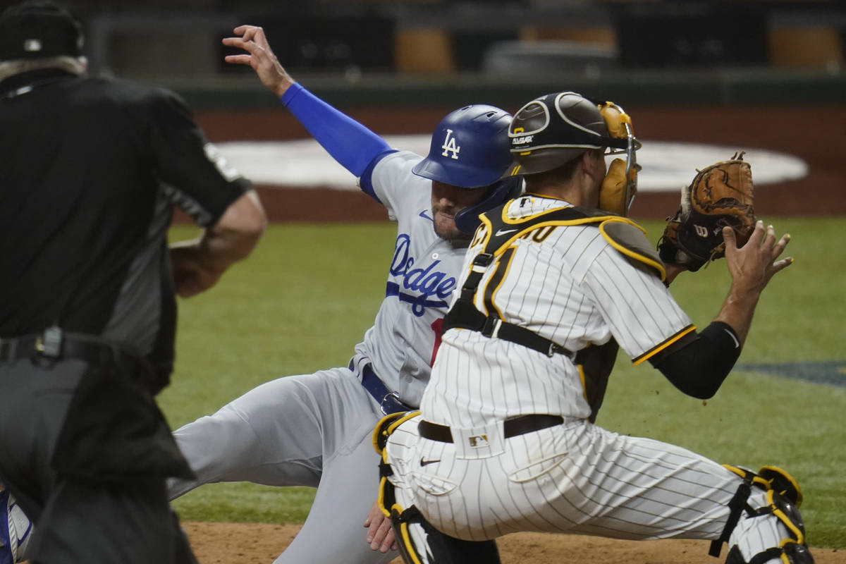 Los Angeles Dodgers' A.J. Pollock (11) beats the throw to score on a single by Joc Pederson dur ...
